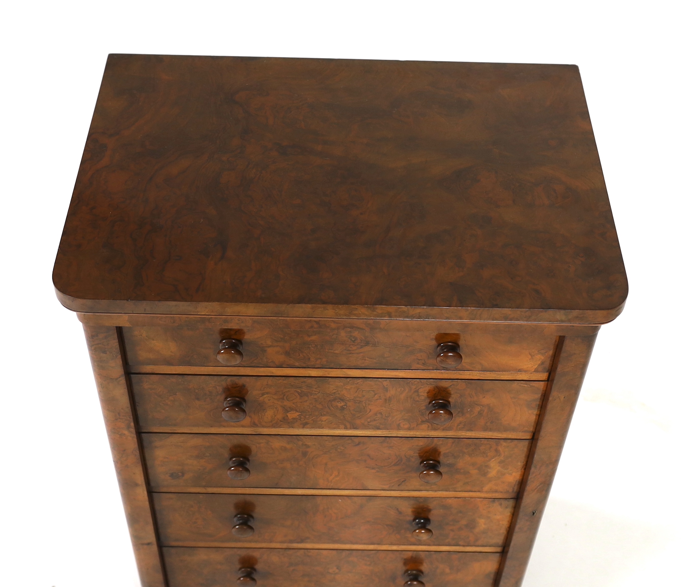 A Victorian walnut Wellington chest, retailed by Toplis & Son, Berners Street, London, width 62cm, depth 43cm, height 102cm